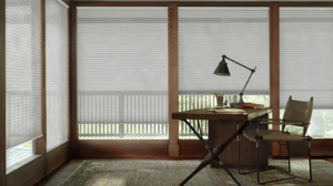 hunter douglas blinds installed in an office - desk and chair with lamp in corner